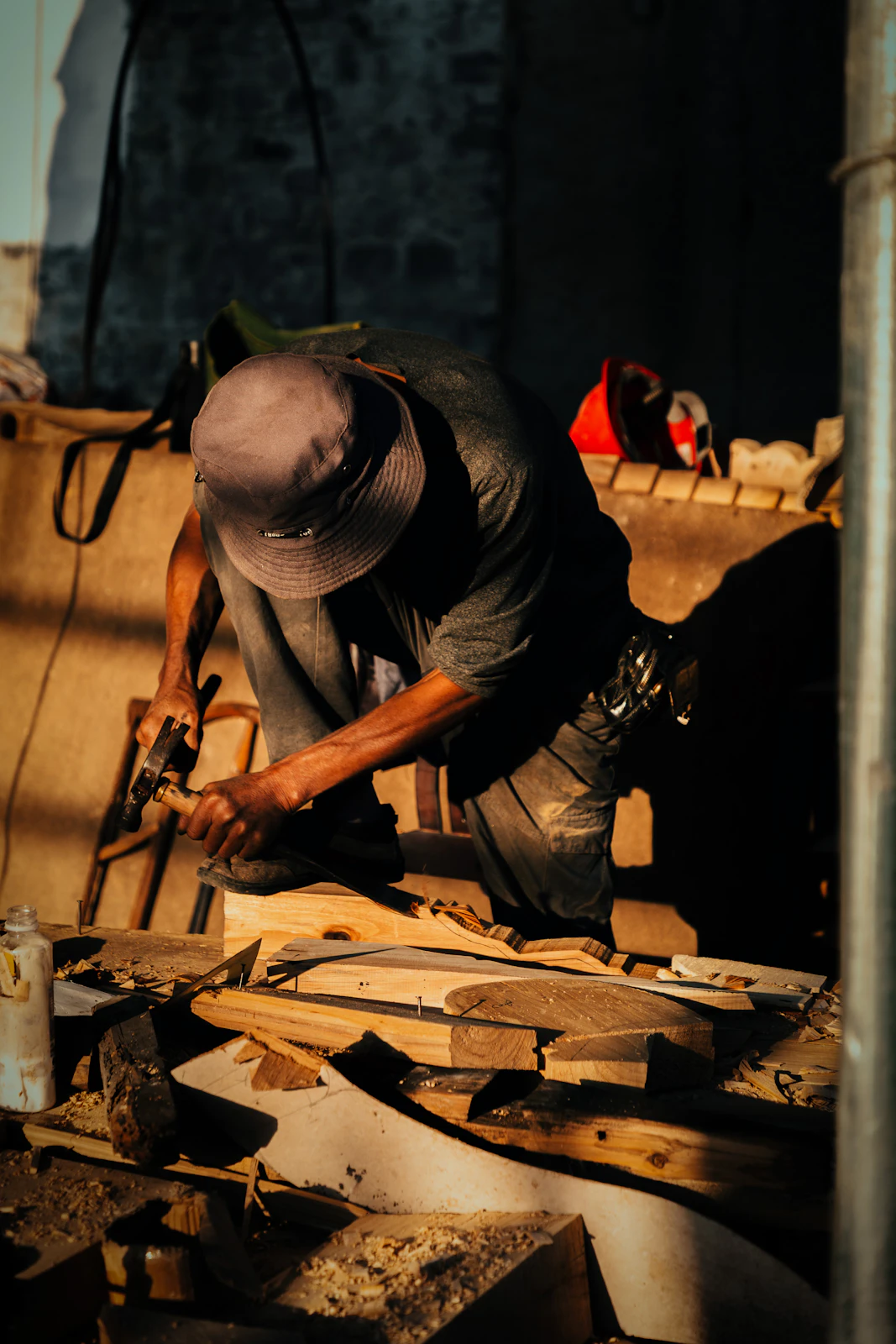 Craftsperson working with wood at a workshop bench