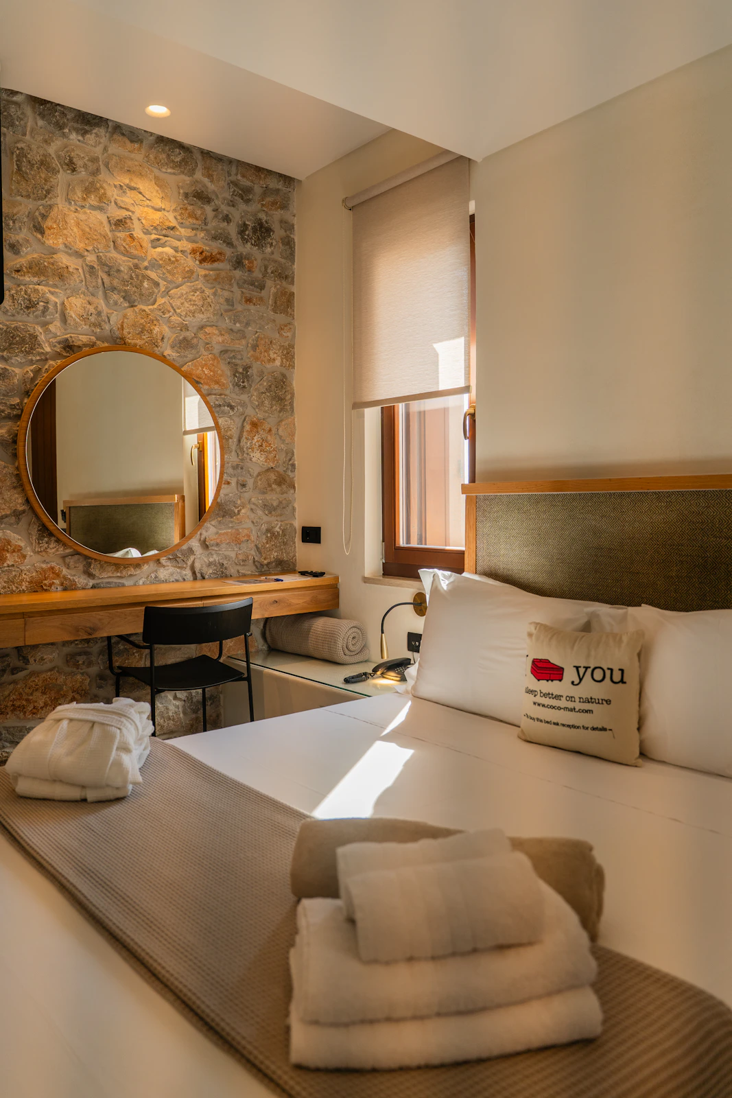 Illustrative hotel bedroom with a carefully made bed