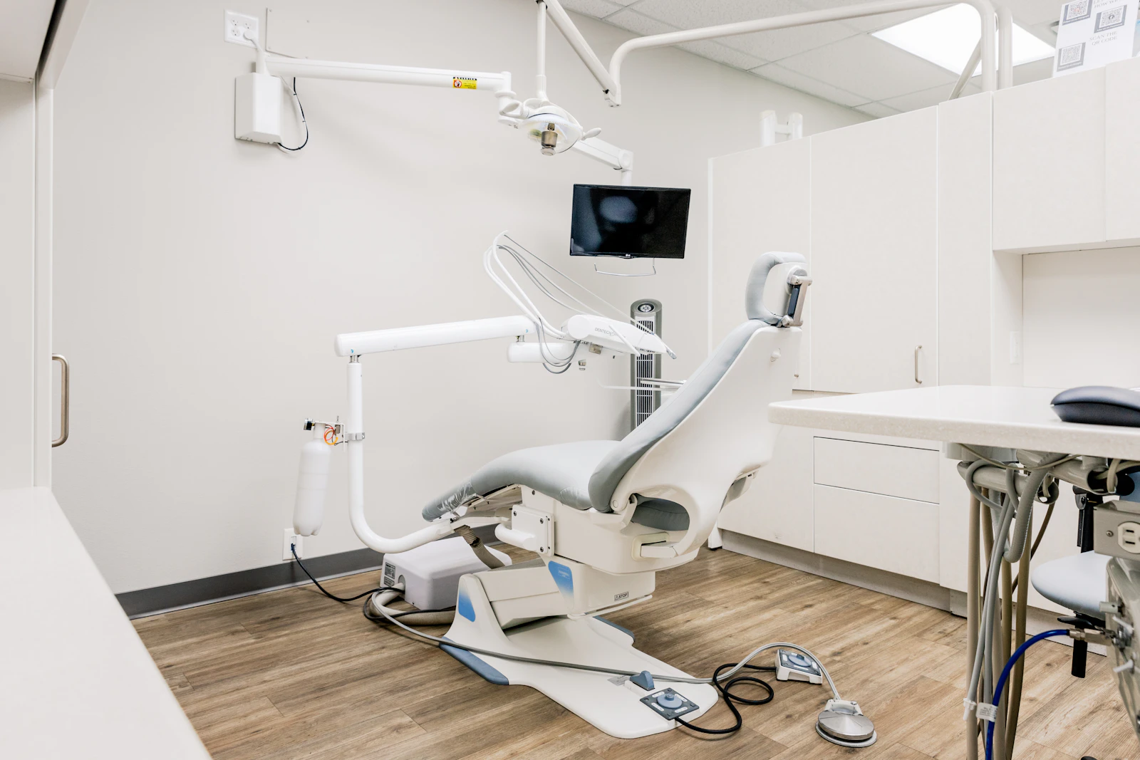 Bright, uncluttered clinical room with treatment equipment
