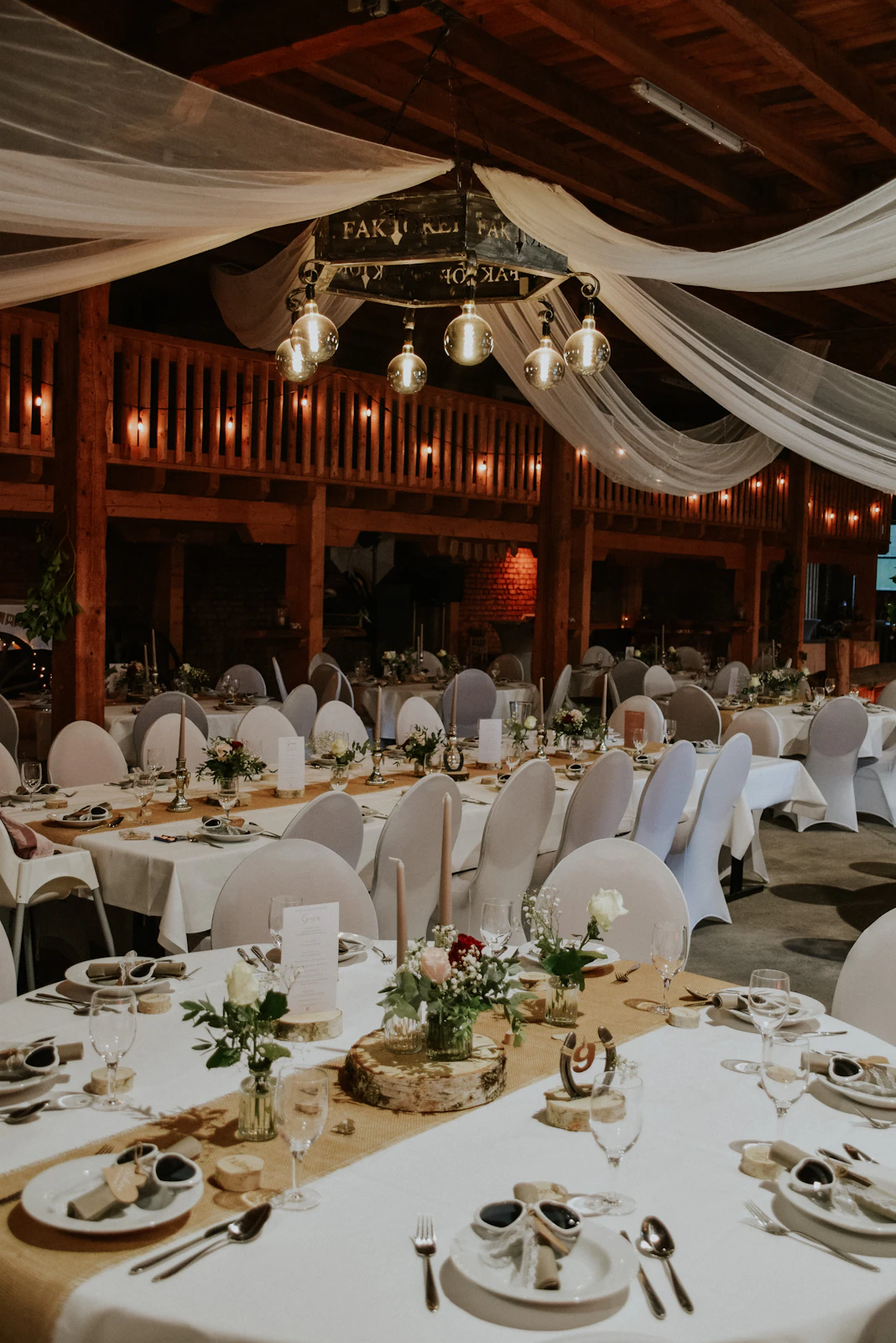 Long reception tables arranged inside an event hall
